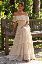 Monique Beige Tiered Maxi Dress, AI-generated seated preview without hat or bag